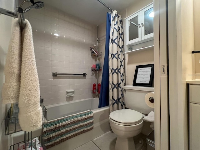 bathroom with tile patterned flooring, toilet, and shower / tub combo