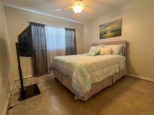 bedroom with a textured ceiling, concrete floors, and ceiling fan