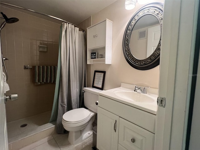 bathroom featuring vanity, toilet, walk in shower, and tile patterned flooring