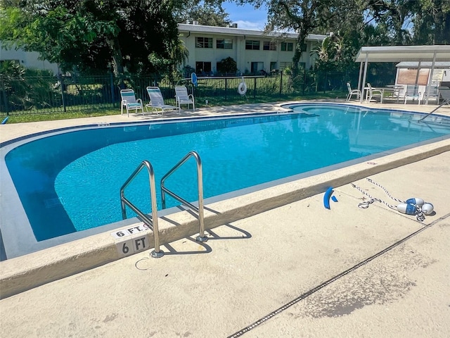 view of swimming pool featuring a patio area