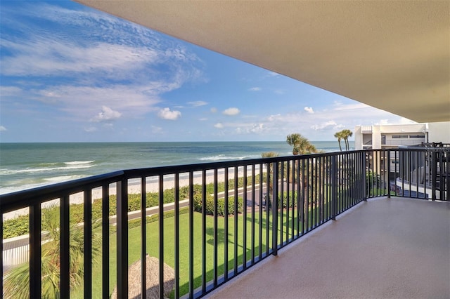 balcony with a beach view and a water view