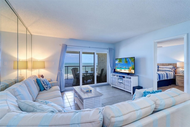 tiled living room with a textured ceiling