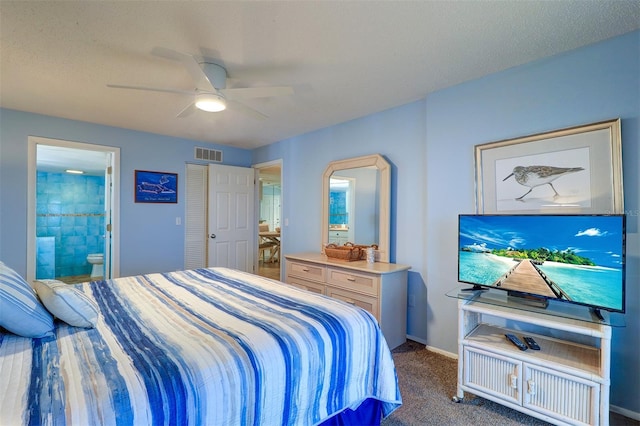 carpeted bedroom with a ceiling fan, visible vents, baseboards, and ensuite bathroom