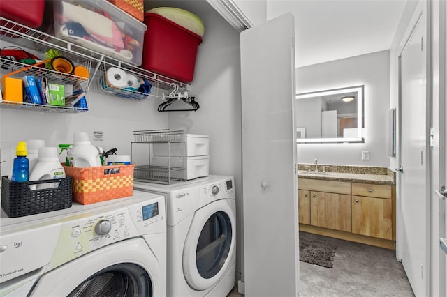 laundry area featuring washer and dryer and sink