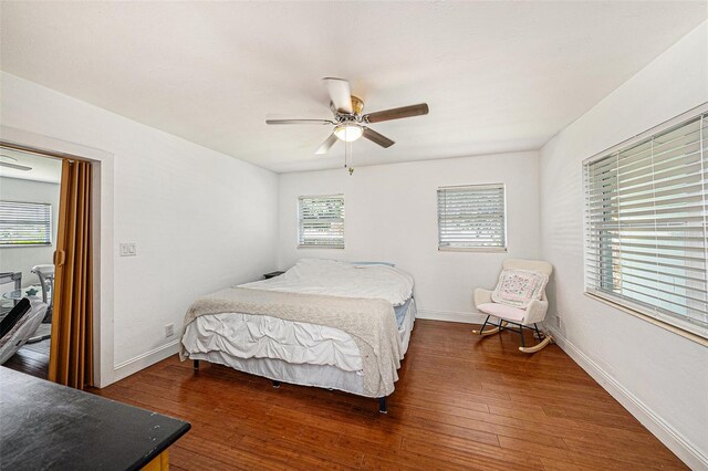 bedroom featuring dark wood-type flooring and ceiling fan