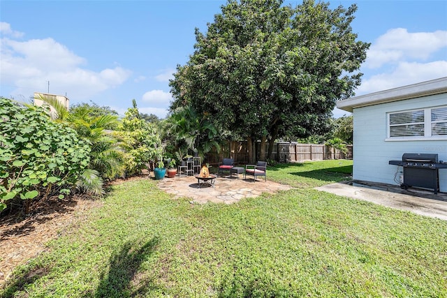 view of yard with a fire pit and a patio