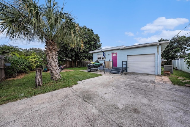 single story home featuring a front lawn and central AC