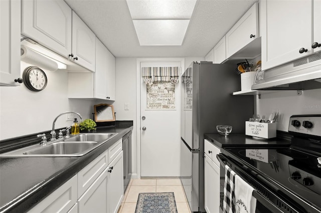 kitchen with white cabinetry, a textured ceiling, light tile patterned floors, sink, and range with electric cooktop