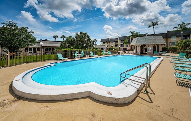 view of swimming pool featuring a patio