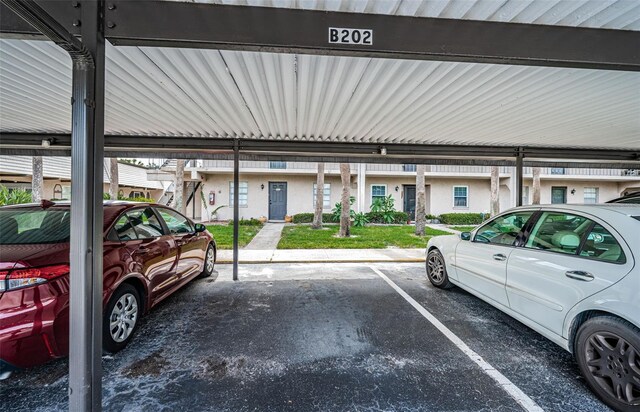 view of vehicle parking with a carport