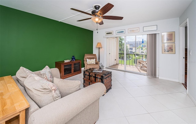 living room featuring ceiling fan and light tile patterned floors