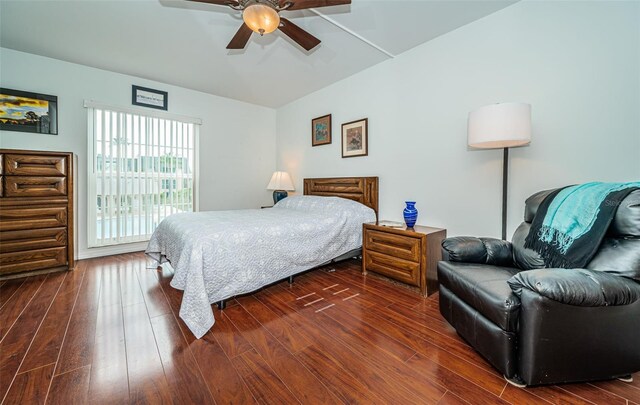 bedroom with ceiling fan and dark hardwood / wood-style floors