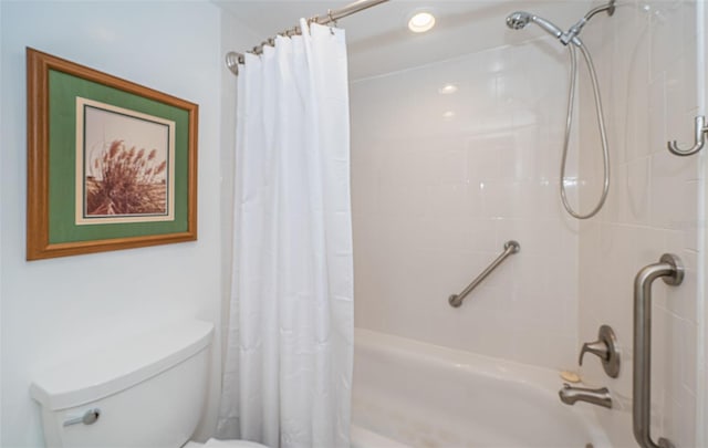 bathroom featuring shower / bath combo and toilet