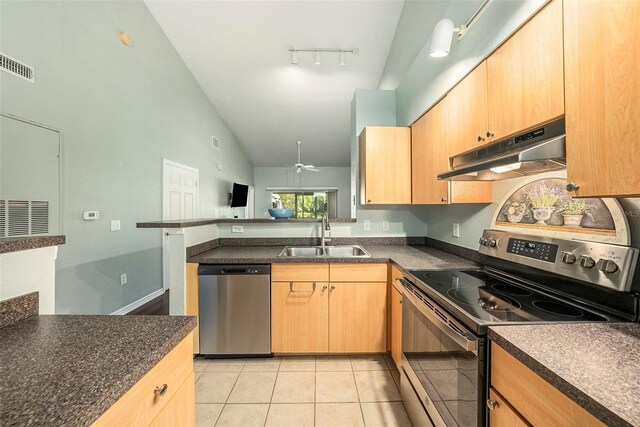 kitchen featuring appliances with stainless steel finishes, sink, light brown cabinets, ceiling fan, and track lighting