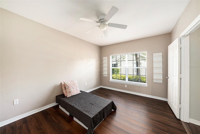 bedroom with ceiling fan and dark hardwood / wood-style floors