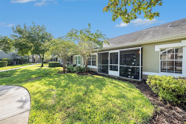 view of yard with a sunroom