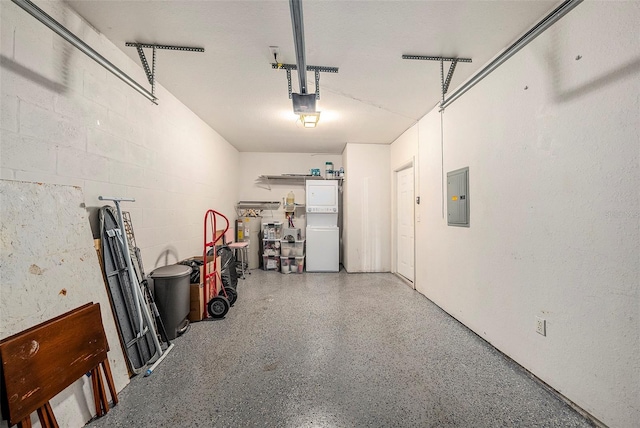 garage with a garage door opener and electric panel