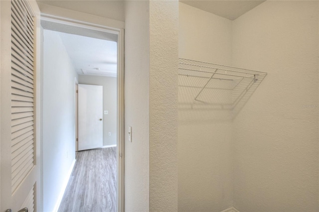 spacious closet featuring hardwood / wood-style flooring