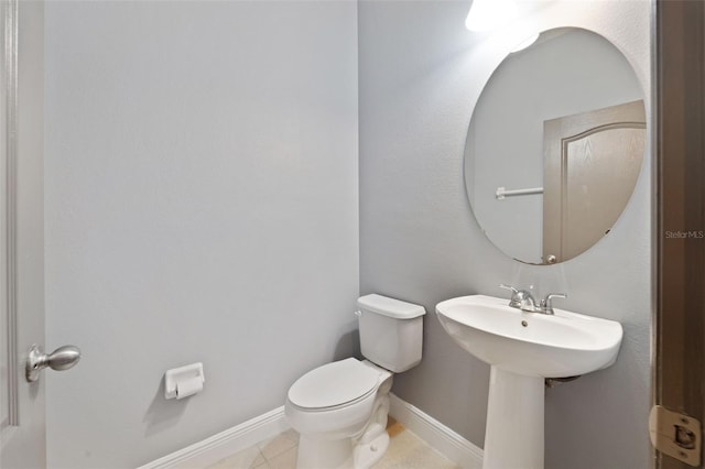 bathroom featuring toilet and tile patterned floors