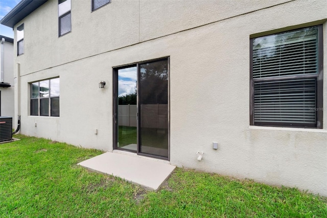 exterior space with a yard and cooling unit