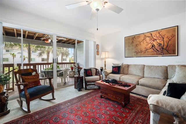 carpeted living room featuring ceiling fan