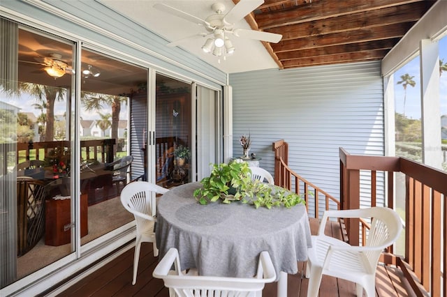 sunroom featuring ceiling fan