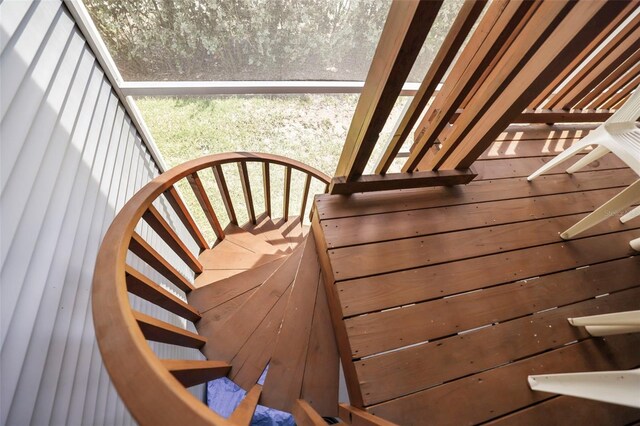 stairs with wood walls