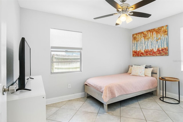 bedroom with ceiling fan and light tile patterned flooring