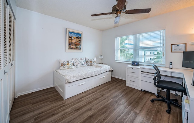 bedroom featuring a closet, ceiling fan, and dark hardwood / wood-style flooring