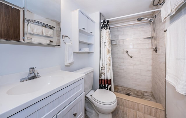 bathroom with vanity, toilet, and curtained shower