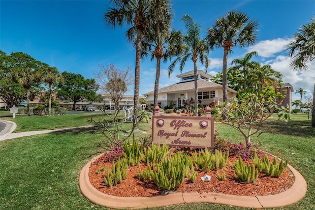 view of property's community with a lawn