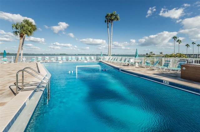 view of pool with a water view