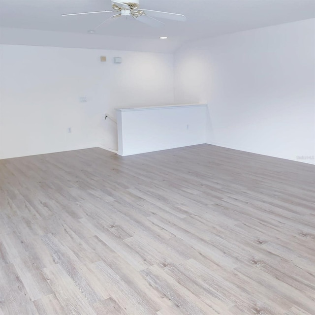 22531 Eagles Watch Dr, Land O Lakes, FL 34639 - spare room with wood finished floors, a ceiling fan, and recessed lighting