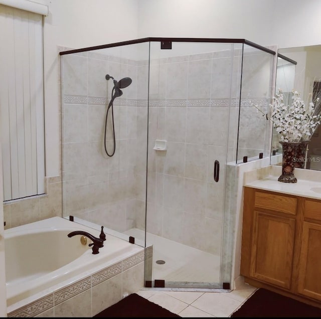 22531 Eagles Watch Dr, Land O Lakes, FL 34639 - bathroom featuring a garden tub, a shower stall, vanity, and tile patterned flooring