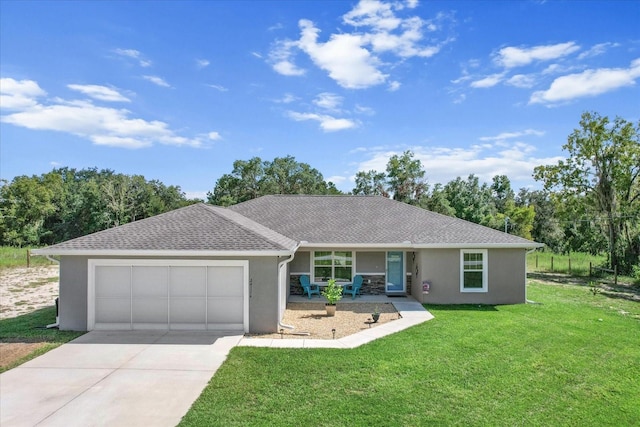 single story home featuring a garage and a front yard