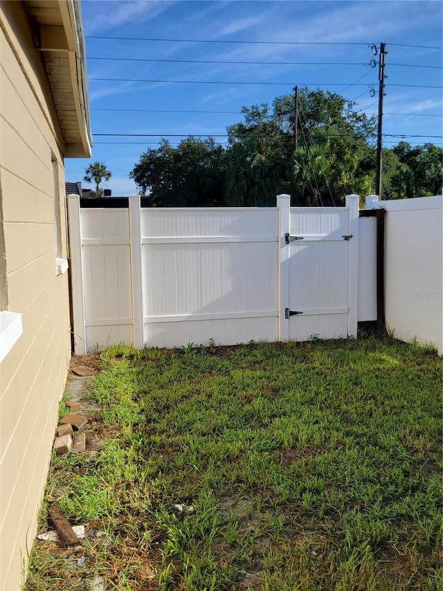 view of yard featuring a gate and fence