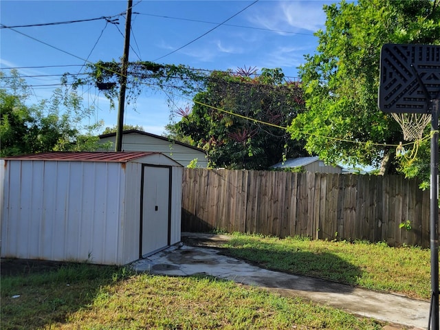 view of shed with fence private yard