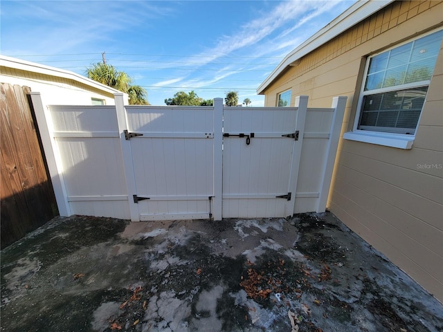 view of gate featuring fence