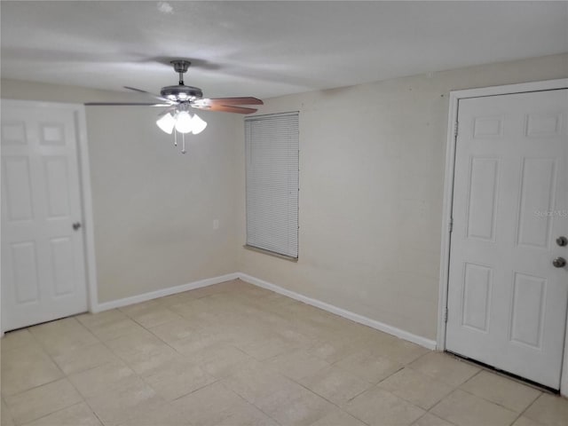 unfurnished bedroom with baseboards and a ceiling fan