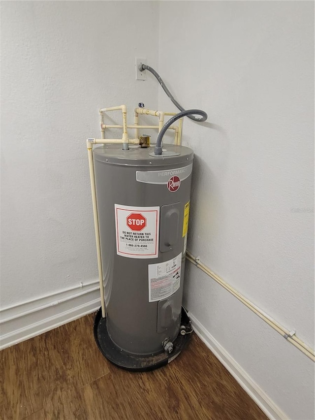 utility room with electric water heater