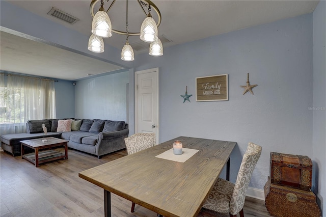 dining area featuring hardwood / wood-style floors