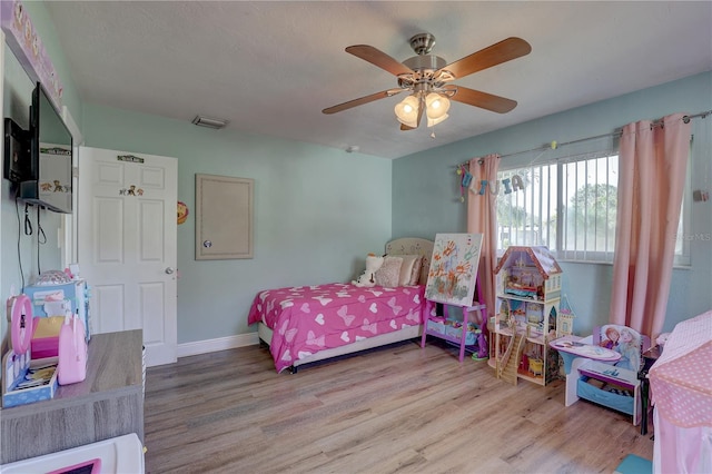 bedroom featuring ceiling fan and light hardwood / wood-style flooring