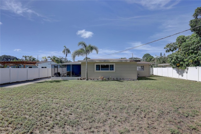 back of house featuring a yard