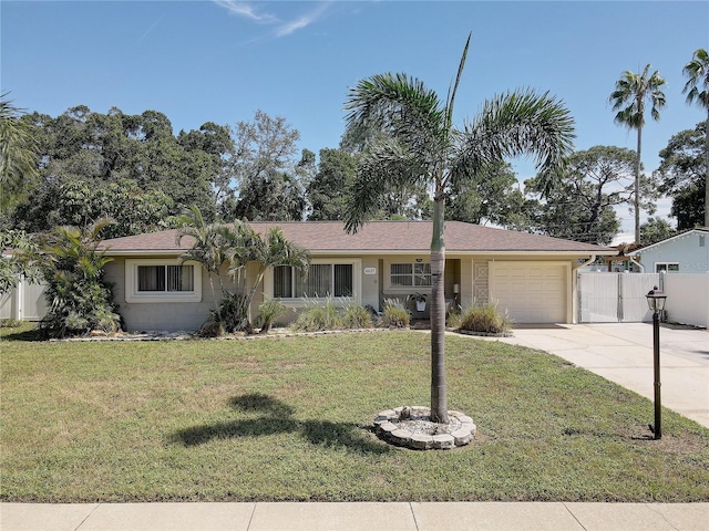 single story home featuring a front yard and a garage