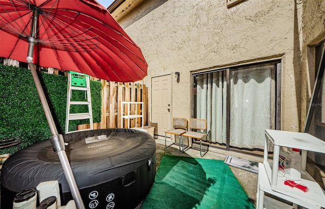 view of patio featuring fence