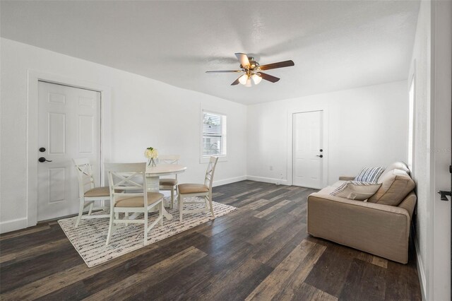 dining space featuring ceiling fan and dark hardwood / wood-style floors