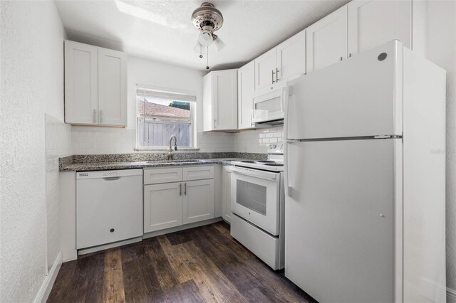 kitchen with sink, dark hardwood / wood-style flooring, white cabinetry, white appliances, and ceiling fan