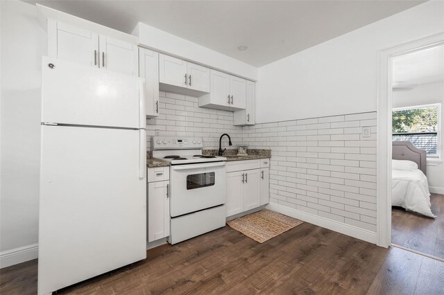 kitchen featuring sink, decorative backsplash, white appliances, dark hardwood / wood-style floors, and white cabinetry