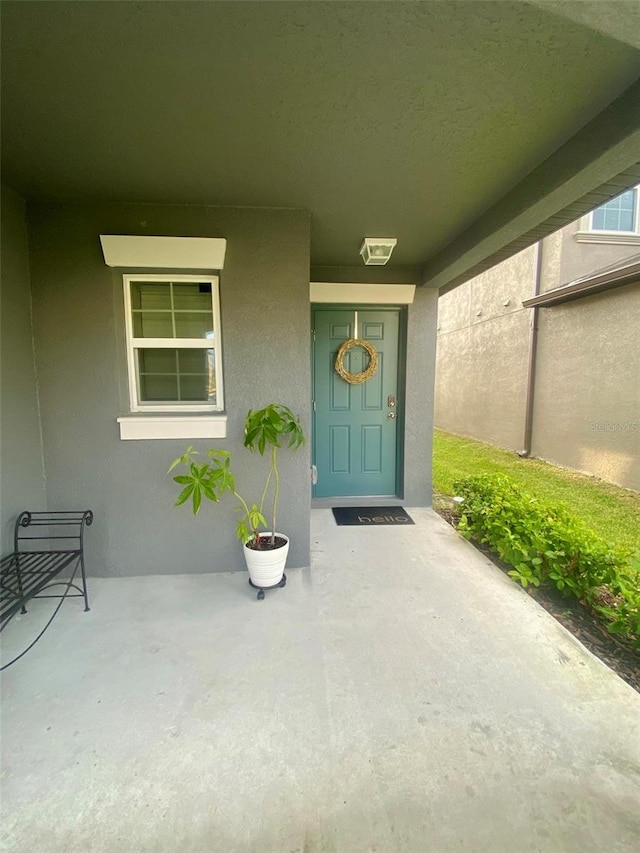 entrance to property with a porch