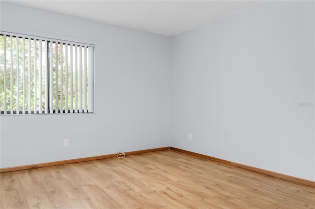 spare room featuring light wood-type flooring